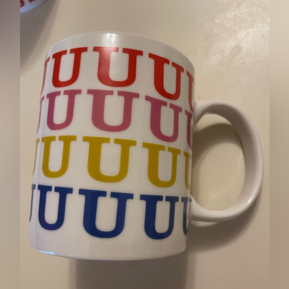 Ashland, ceramic coffee mug featuring multicolor letter U